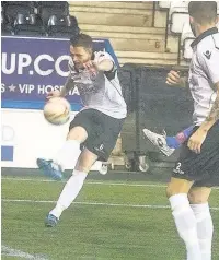  ?? John Rooney ?? Steve Akrigg clears the ball for Widnes FC against City of Liverpool FC.