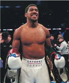  ?? PA; Reuters ?? Anthony Joshua, top, lands a punch on Alexander Povetkin on Saturday and, above, celebrates his victory