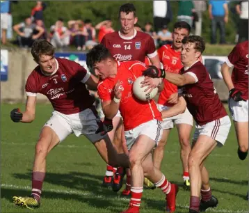  ??  ?? Fethard’s Mikie Dwyer under pressure from the O’Connor brothers, Jack and Harry.