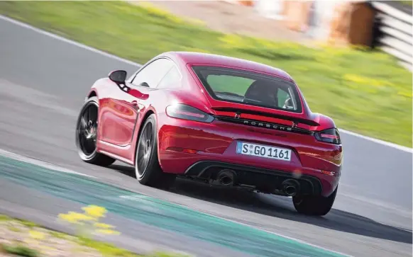  ??  ?? The Cayman’s exploitabl­e midengined chassis can be happily corrupted by 400bhp for this sort of track action