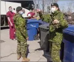  ?? Canadian Press file photo/Ryan Remiorz ?? Canadian Armed Forces personnel arrive at the Villa Val des Arbes seniors residence on April 20. As the military prepares to pull out of the homes, 900 Red Cross workers will take their place.