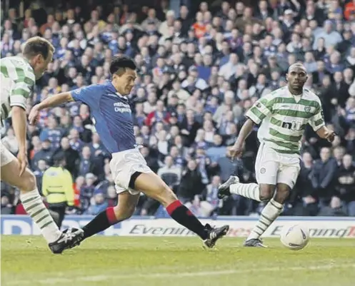  ?? ?? 0 Michael Mols scores the winning goal for Rangers in their 3-2 victory over Celtic at Ibrox in a league game in December 2002