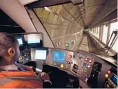  ?? JUSTIN TALLIS/GETTY-AFP ?? A driver prepares to take a train on London’s new Elizabeth Line for a test run Wednesday. The new line is scheduled to open for customers May 24.