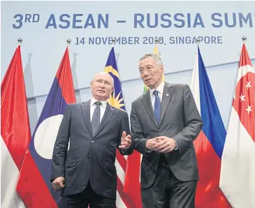  ?? REUTERS ?? Russian President Vladimir Putin, left, and Singapore’s Prime Minister Lee Hsien Loong appear at the Asean-Russia Summit in Singapore on Nov 14. Asean has elevated Russia and the European Union to strategic partners.