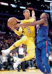  ??  ?? Jordan Clarkson (left) of Los Angeles Lakers in action in their NBA game against Los Angeles Clippers. —