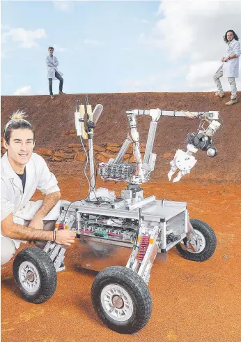  ?? Picture: IAN CURRIE ?? Monash students Daniel Ricardo, Joel Kuperholz and Ayden Monsant are part of a team that have built an autonomous rover that will compete for the chance to go to work on Mars.