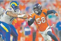  ?? JACK DEMPSEY/ASSOCIATED PRESS ?? Broncos linebacker Von Miller, right, battles Rams guard Tremayne Anchrum on Saturday in Denver.