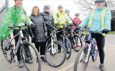  ??  ?? On your bikes Leaving St John’s Primary, riders included PC Stevie Lowrie and Biketown bike leader Fiona Campbell (right)