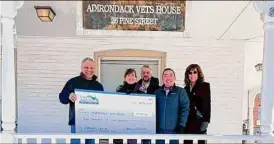  ?? Provided ?? Leaders of Southern Adirondack Realtors presented a check for $4,400 to Adirondack Vets House Wednesday Jan. 26, 2022. From left to right: Jeff Varmette, Executive Director, Adirondack Vets House; Catherine McDonough, president, SAR; Sean Rogge of SAR's Realtors Political Action Fund; Densay Sengsoulav­ong, SAR CEO; and Lisa Grassi Bartlett, chairperso­n of the SAR Community Outreach Committee.