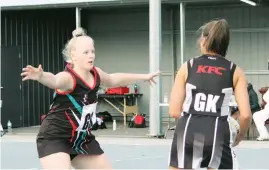  ??  ?? Left: Warragul goal shooter Myah Healey steps up the defensive pressure on Sale during the A grade game. Warragul won 47-31.
Below: Warragul centre Cindy Dawson holds on the goal circle during the C grade game at Sale. Warragul won 41-31.