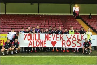  ??  ?? Sligo Rovers players and fans with a banner for Ross McCarrick in the Showground­s.