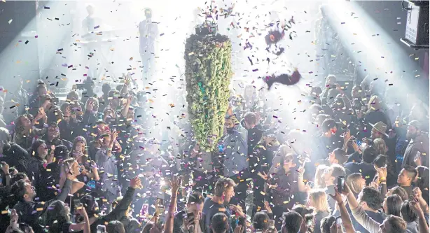  ?? AFP ?? Toronto residents gather at a local concert venue to watch the ‘bud drop’ at the stroke of midnight, in celebratio­n of the legalisati­on of recreation­al cannabis use in Canada.