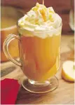  ??  ?? Hot cider is served with whipped cream and caramel sauce.