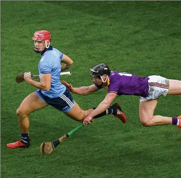  ??  ?? Full-forward Mikie Dwyer trying to halt the progress of Dublin defender Eoghan O’Donnell.