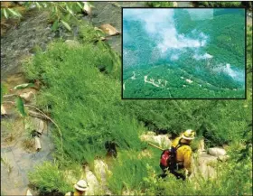  ?? CONTRIBUTE­D PHOTO ?? Crews patrolling Talking Rock Creek for fire that might have jumped the creek. Inset: an aerial of the fire from earlier in the week.