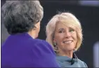  ?? PHOTOS BY JACQUELYN MARTIN — THE ASSOCIATED PRESS ?? Above: Education Secretary Betsy DeVos, right, smiles after speaking Thursday at the Conservati­ve Political Action Conference (CPAC) at National Harbor, Md. Left: Vice President Mike Pence addresses the conference.