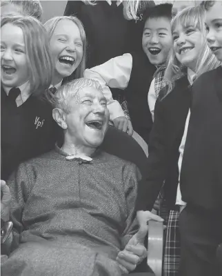  ?? JULIE OLIVER ?? Dr. Agatha Sidlauskas — “Doc” as the students called her — is seen shortly before her 100th birthday in 2013 with some of the pupils at Carp’s Venta Preparator­y School, which she founded. At the time, she was still very involved in the affairs of the...