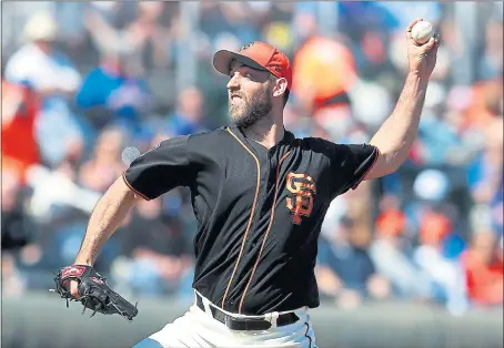  ?? ARIC CRABB — STAFF PHOTOGRAPH­ER ?? “I felt good physically, and that’s really what I’m looking for,” Giants left-hander Madison Bumgarner said about his first spring game start Sunday against the Chicago Cubs in which the team’s ace gave up four hits and struck out five in 1 2⁄3...