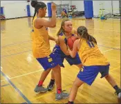  ?? PHOTOS BY WILLIAM HARVEY/TRI-LAKES EDITION ?? Junior Ashley Sweeney fights for the ball while defended by fellow Lady Yellowjack­ets.