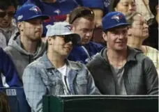  ?? STEVE RUSSELL/TORONTO STAR ?? Leafs rookie sensation Auston Matthews, in shades and a grey cap, takes in Saturday’s Jays-Rays game at the Rogers Centre.