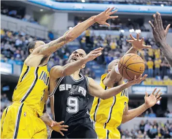  ?? AP ?? The Spurs’ Tony Parker, centre, in action against the Pacers.