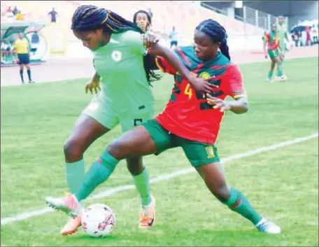  ?? ?? Goalscorer Esther Okoronkwo (left) in a duel with Cameroon’s Mariane Maague in Abuja .... on Monday