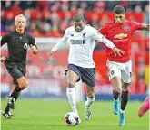  ??  ?? Liverpool’s Georginio Wijnaldum (left) and Marcus Rashford of Manchester United vie for the ball