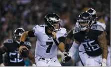  ?? MATT ROURKE — THE ASSOCIATED PRESS ?? Nate Sudfeld, on the run in a preseason game against the Tennessee Titans last August, still shapes up to be the backup quarterbac­k behind Carson Wentz for the Eagles.