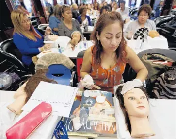  ?? Francine Orr Los Angeles Times ?? EMMA JUAREZ LOPEZ, an apprentice in the Cosmetica program in Downey, is taking advantage of a state law that allows immigrants in the U.S. illegally to get licenses for work as beautician­s and other profession­s.