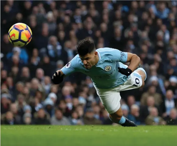  ?? Getty ?? A pair of goals from Sergio Aguero yesterday helped Manchester City continue to fly high above their would-be pursuers at the top of the Premier League table