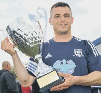  ??  ?? Southwick captain Anth Stokell holds the Total Sport Challenge Trophy. Pictures by Tim Richardson.