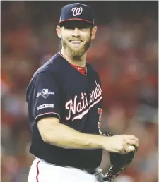  ?? ROB CARR/GETTY IMAGES ?? Stephen Strasburg, pictured, will be on the mound in Game 2, Nationals’ general manager Mike Rizzo said Friday. Max Scherzer is expected to start the opening game.