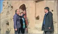  ?? PROVIDED TO CHINA DAILY ?? Yu Hao (first from left) discusses cultural relics protection with his colleagues in the Tianlong Mountain grottoes in Taiyuan, Shanxi province.