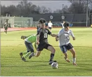  ?? Tim Godbee ?? Calhoun senior midfielder Cristian Delgado maneuvers past a Coahualla Creek defender and the goalkeeper for a loose ball during the Yellow Jackets’ tough 2-1 loss to the Colts last week.