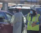  ?? NICK OZA/USA TODAY NETWORK ?? Doctors and nurses prepare to give COVID-19 vaccines to members of the Navajo Nation who are 75 and older at the Tséhootsoo­í Medical Center in Fort Defiance, Ariz., last month.