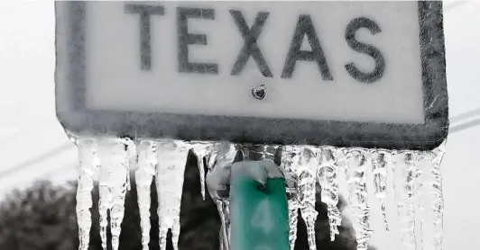  ?? Joe Raedle / Getty Images ?? Icicles hanging off a Texas 195 sign in Killeen are a reminder of what can happen, even in the South. Next time a winter storm hits, be prepared.