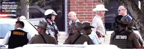  ??  ?? Aftermath: Police at the high school in Santa Fe