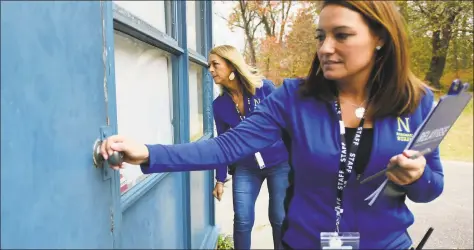  ?? Erik Trautmann / Hearst Connecticu­t Media ?? Naramake Elementary School Site Director Shannon Roman, right, and Principal Jane Wilkins work through the school to make sure doors are locked and blinds closed during a drill on Nov. 22 at the school in Norwalk. In the post- coronaviru­s world, pandemic drills may become a regular part of school life like lockdowns and shelter- in- place drills.