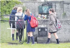  ?? AFP ?? Children arrive at a shrine in Tuam, County Galway, erected in memory of up to 800 babies who were allegedly buried at the site of the former home for unmarried mothers.
