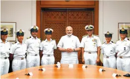  ?? — PTI ?? Prime Minister Narendra Modi meets the Indian Navy’s six- member all- women crew of INSV Tarini, who circumnavi­gated the globe in over eight months, in New Delhi, on Wednesday. Indian Navy chief Admiral, Sunil Lanba is also seen.