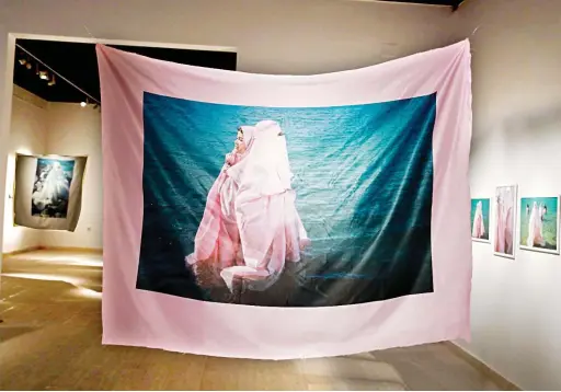  ?? Supplied by Yassir Alhaidari ?? The exhibition presents a series of photo sculptures that explores the tension, freedom, and beauty present in women’s lives through the use of fabric and the metaphor of the mermaid.