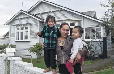 ?? PHOTO: PETER MCINTOSH ?? Future home . . . Standing outside their future home in Tainui are Ki’anie Pikia, her son Galaxie (3, left) and daughter Elegance (2).