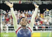  ?? PHOTO BY ALEX LIVESEY/ GETTY IMAGES ?? Simone Biles of the United States waves to fans after winning the gold medal during the Women’s Individual All Around Final at the 2016 Rio Olympics.
