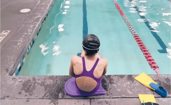  ?? RICK BOWMER/AP ?? A proposed ban on transgende­r athletes playing girls school sports in Utah would affect transgende­r girls like this 12-year-old swimmer. She cried when she heard about the legislativ­e proposal, which would separate her from her friends.