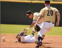  ??  ?? Butte College’s Brennan White applies a tag to a baserunner as pitcher Logan Meyers looks on during the Roadrunner­s’ home matchup against College of the Siskiyous on Saturday. The Roadrunner­s won both ends of a doublehead­er to open their spring season with two victories.