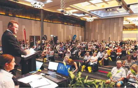  ?? Picture: Jason O'Brien ?? Auctioneer Andrew Bell during Ray White's annual auction The Event at RACV Royal Pine Resort.