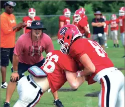  ?? LARRY GREESON / For the Calhoun Times ?? Sonoravill­e head coach Denver Pate (left) looks on during a drill at a recent practice. The Phoenix will square off with Gordon Central on Friday in a preseason scrimmage at 7:30 p.m. at Ratner Stadium.