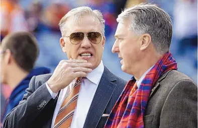  ?? JACK DEMPSEY/ASSOCIATED PRESS ?? John Elway, left, stands with Denver Broncos president and CEO Joe Ellis before the game against the Raiders on Jan. 3. The Broncos’ new general manager will join an organizati­on embroiled in a family ownership feud.