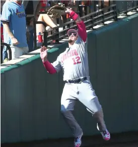  ?? | CHRIS LEE/ AP ?? Left fielder Kyle Schwarber fails to catch a foul fly Saturday against the Cardinals in St. Louis. He is a minus- 5 in defensive runs saved this season.