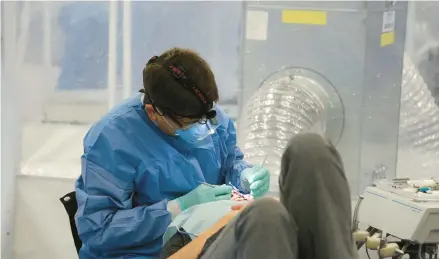  ?? REMOTE AREA MEDICAL ?? A patient at a Remote Area Medical operated clinic receives free dental work.